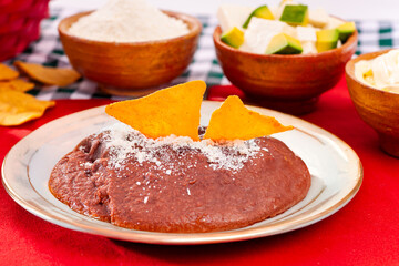 Red beans topped with organic corn nachos.
