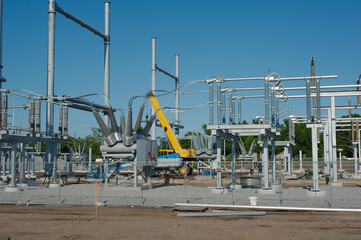 Substation Construction Site Featuring Industrial Infrastructure and Extensive Modern Equipment. Utility setups in progress. Part of an electrical grid. Captures the essence of modern engineering and 