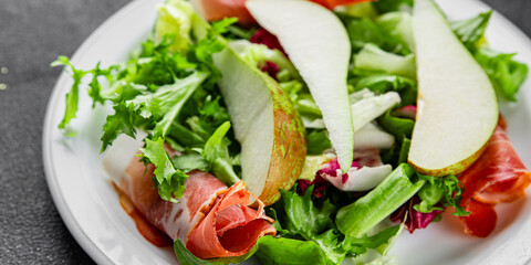 Salad pear ham vegetable dish fresh tasty gourmet food background on the table rustic food top view copy space