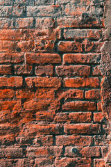 Texture of an old worn brick wall as background