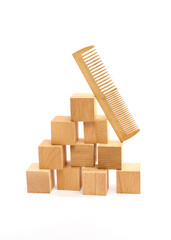 Obraz premium classic wooden comb on a white background
