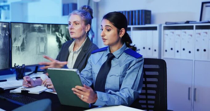 Women, security guard and tablet with team at screen for talk, listen or strategy at surveillance office. People, monitor and alert for danger on application, advice and notes for safety services