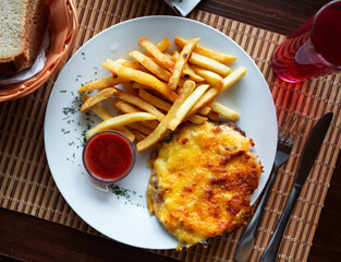 French style meat with cheese and potatoes, traditional Russian cuisine