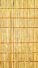 Natural bamboo mat texture with vertical thin sticks and horizontal thread bindings for eco interior design and craft backgrounds. Concept of organic material, natural texture, copy space. Vertical
