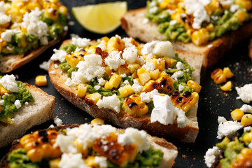 Grilled corn and avocado sourdough toast with soft goats cheese