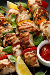 Chicken kebab skewers on a plate with vegetables. Mediterranean healthy food