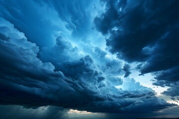 Obraz premium Dark Storm Cloudscape: A dramatic and intense image featuring a sky filled with dark, brooding storm clouds, creating a powerful and atmospheric scene.