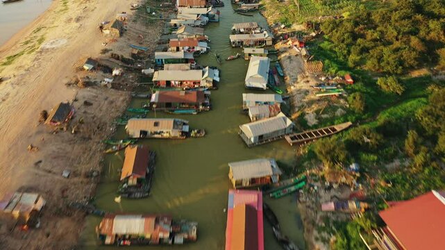 Traditional houses in the floating village of Chong Kneas near Tonle Sap Lake in Asia, Cambodia, near Siem Reap, in summer on a sunny day.&nbsp;
