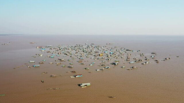 The beautiful floating village of Chong Kneas on Tonle Sap Lake in Asia, Cambodia, near Siem Reap, in summer on a sunny day.