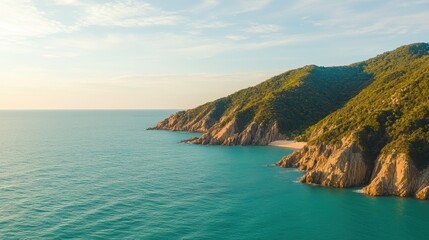 Fototapeta premium Scenic coastline with clear waters and lush hills.