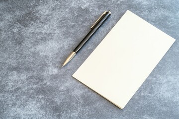 Blank notepad and pen on textured background business office planning writing communication minimalist design