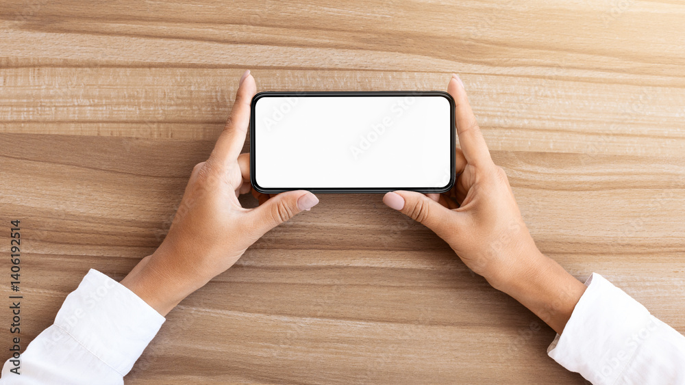 Aufkleber Girl watching video or playing game on cell phone in horizontal position. Isolated screen for app mock up
