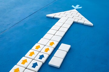 Ascending Arrow: An eye-level perspective captures a composed arrow shape, crafted with precision from white tiles on a blue background.