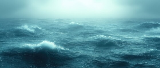 Fototapeta premium The ocean's waves crash, blue and foamy under the sky, a vast expanse of water