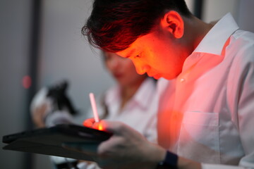 The research team is examining the robotic arm and developing new innovations. Bio-machines in the...