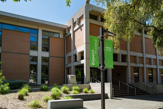 An "Expect Justice" banner flies outside the School of Law at U.C. Davis. At least 23 international students and recent graduates have had their visas revoked by the Trump administration.