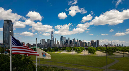 New York City near American flag, United States, USA. NYC skyline. Panorama of New York. New York skyscrapers. Beautiful view in Manhattan, Empire State Building in NYC. The New York Times Building.
