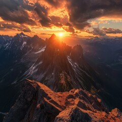 Obraz premium Majestic Sunset Over Rugged Mountain Peaks with Dramatic Clouds Illuminating the Sky in a Vibrant Display of Nature's Beauty and Tranquility