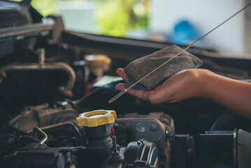 Close up Man hands fixing Car machinery vehicle mechanical service. Mechanic man hands repairing...