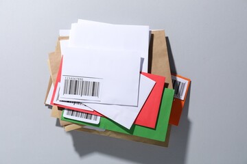Different paper envelopes on light grey background, top view. Post office