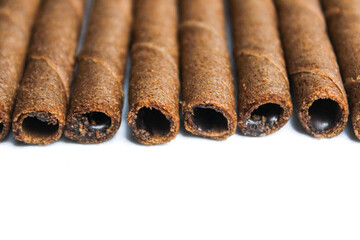 Close up of Chocolate wafer rolls isolated on white background