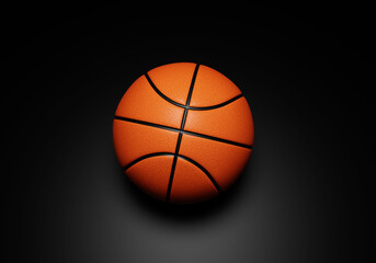 Fototapeta premium Orange basketball ball on black background