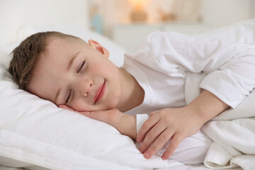 Bedtime. Cute boy sleeping in comfortable bed
