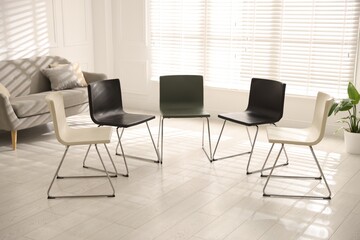 Chairs in circle prepared for group psychotherapy session indoors