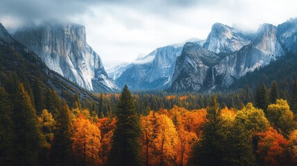 Autumn forest spreading across foothills of tall granite mountains with vivid colors