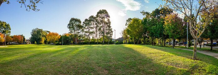 Panoramic view of a spacious suburban park in Werribee, Melbourne,with open green lawns, mature trees, and well-kept environment in a peaceful neighborhood. Public community outdoor space in Australia