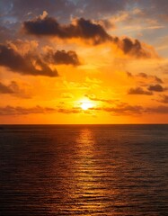 Naklejka premium Sunset, Sky clouds over sea in the Evening with Orange, Yellow Gold sunlight in Golden hour