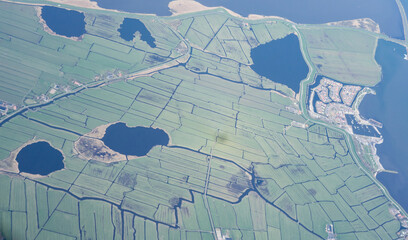 Netherlands, Holland, Dutch,  Aerial view of city outskirts in the day from an aeroplane window