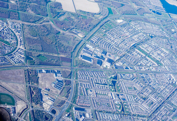 Netherlands, Holland, Dutch, Aerial view of city outskirts in the day from an aeroplane window