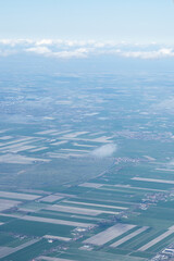 Netherlands, Holland, Dutch, Aerial view of city outskirts in the day from an aeroplane window