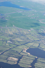 Netherlands, Holland, Dutch,  Aerial view of city outskirts in the day from an aeroplane window