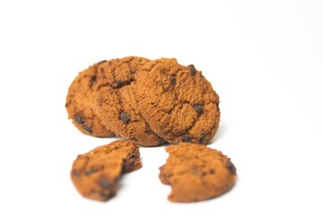 Broken cookies with chocolate topping isolated on white background. oatmeal, free space food.