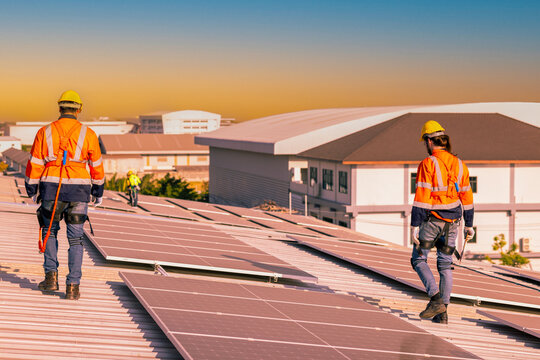 Green Energy, Professional Engineer Service Solar Panel. Worker Maintenance Cleaning Replacing Solar Panel. Solar photovoltaic panel system in Industry roof. Saving Energy with Clean Power.
