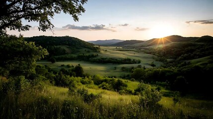 Obraz premium Sunset Serene Hilltop Vista with Rolling Green Meadows.