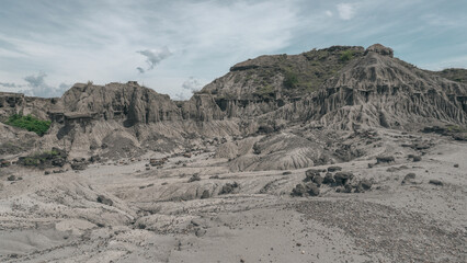 Path Through the Desert Vegetation in Colombia. A narrow trail cutting through arid vegetation with cacti and dry shrubs. Taken during sunset in a Colombian dry forest ecosystem, this photo is ideal f