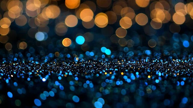 This captivating blue and gold bokeh background features sparkling lights and a shimmering texture, perfect for festive themes and creative projects.