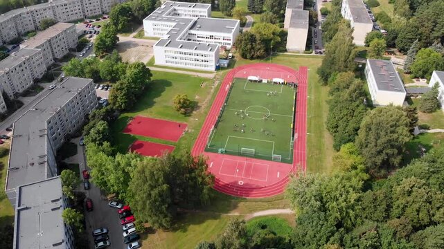 Drone shot of people playing Spikeball in a stadium