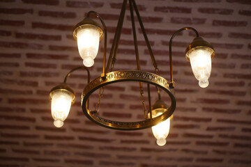 Vintage chandelier with warm lighting in cozy indoor space