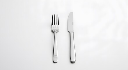 Sleek Stainless Steel Fork and Knife on White Background. Minimalist Design Flatware