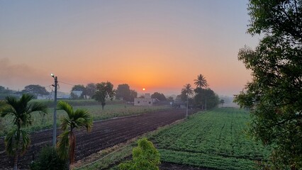 Golden Sunrise Over an Indian Village