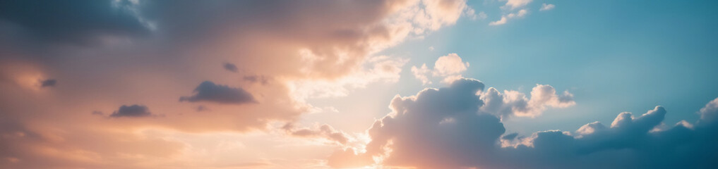 Obraz premium Heavenly Canvas: An awe-inspiring view of fluffy clouds illuminated by the radiant sun, transforming the sky into a canvas of breathtaking colors and textures.
