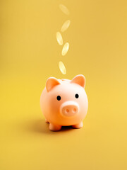 Saving money, retirement plan, security budget, business investment concept. Cute face pink piggy bank with falling golden coins isolated on yellow color background, vertical style, minimalist.