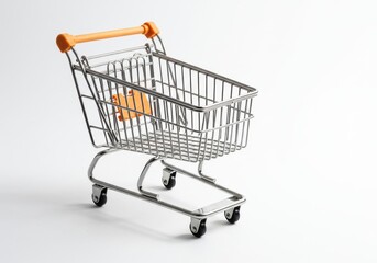 A miniature shopping cart with an orange handle and tag on a white background in a studio shot