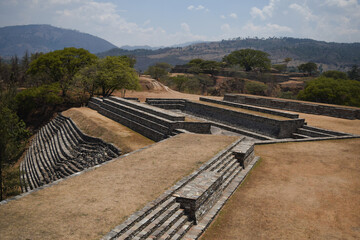 Photograph of ancient Mayan structures built into the mountain