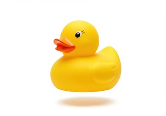 A bright yellow rubber duck with an orange beak isolated on a white background with a shadow below