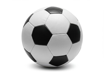 Fototapeta premium A monochrome soccer ball with black pentagons and white hexagons on a plain white background in studio shot